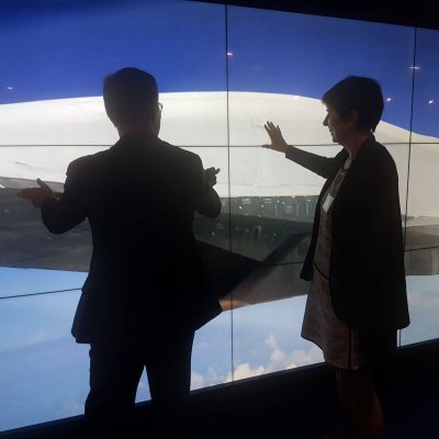 Dignitaries learn more about joint UQ-Boeing initiatives via a massive digital touch screen